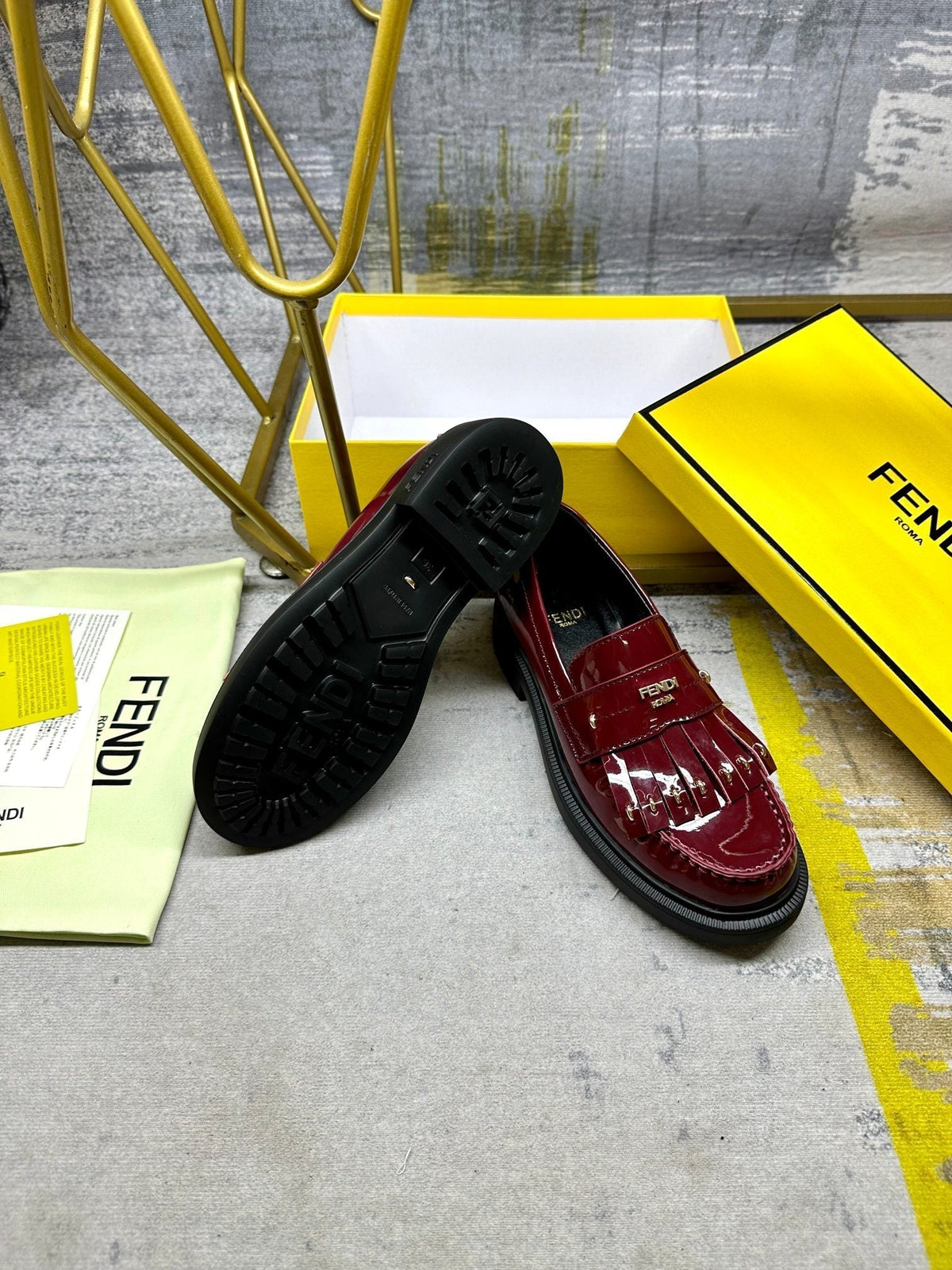 FENDI BAGUETTE LOAFERS IN MAROON RED CALFSKIN WITH GOLD HARDWARE