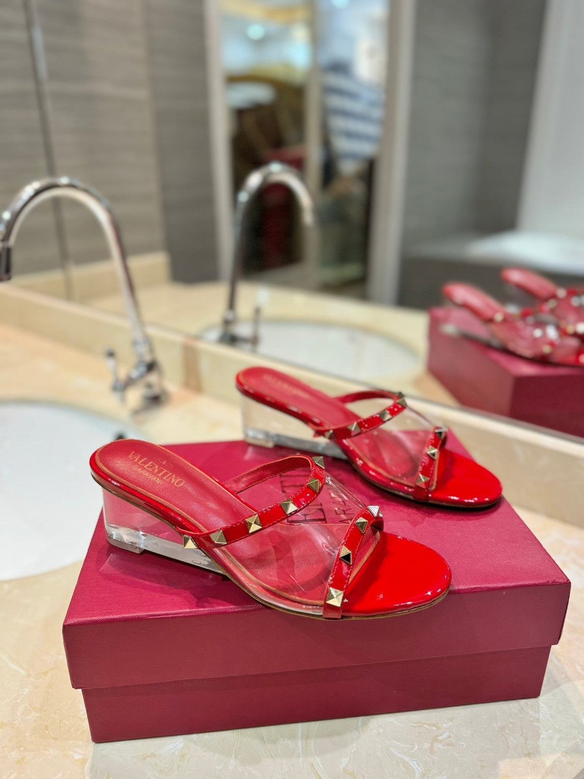 ROCKSTUD MULE SANDALS IN CHERRY RED CALFSKIN AND TRANSPARENT PVC FILM