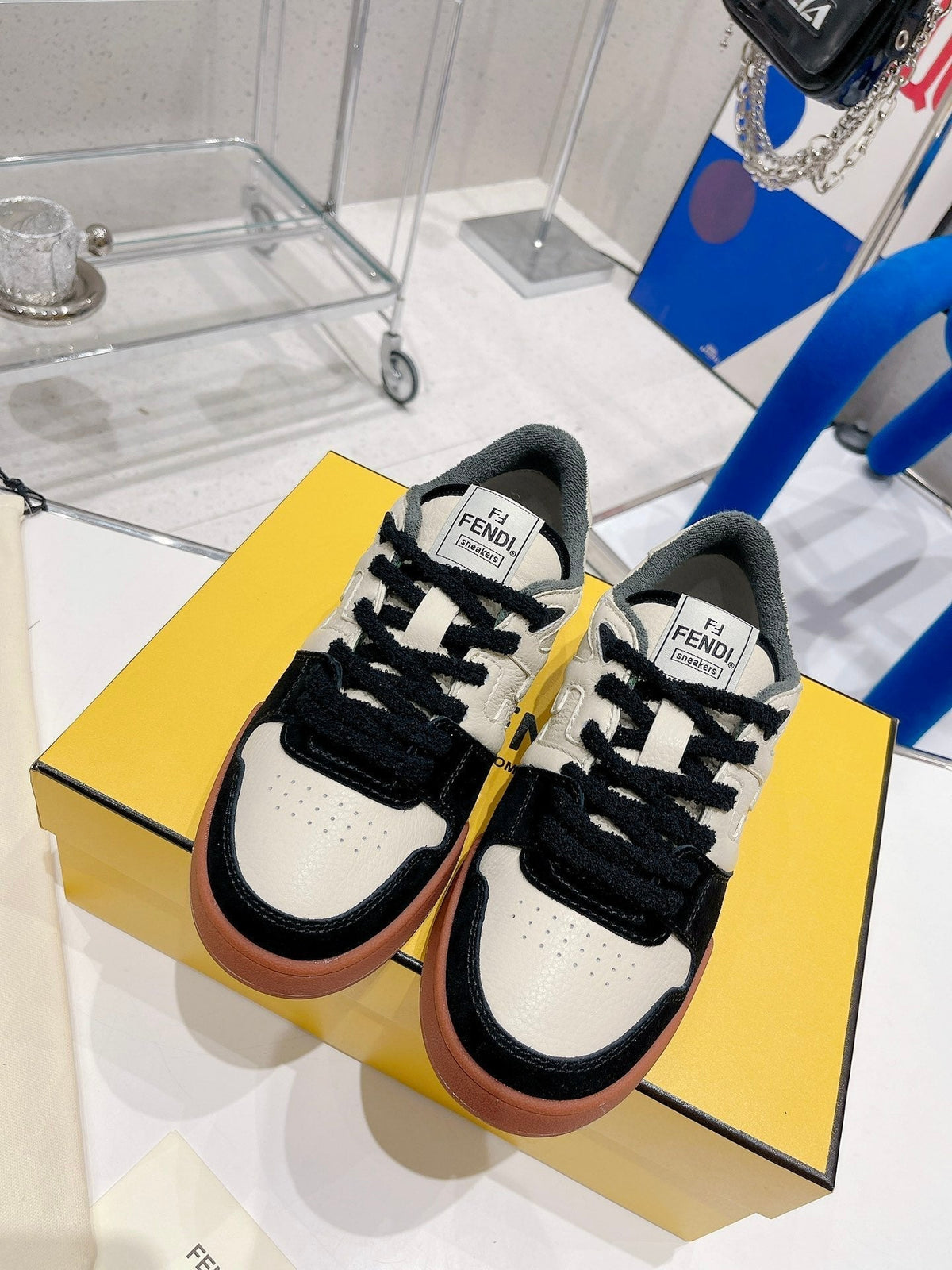 FENDI CASUAL SNEAKER IN WHITE CALFSKIN AND BLACK SUEDE