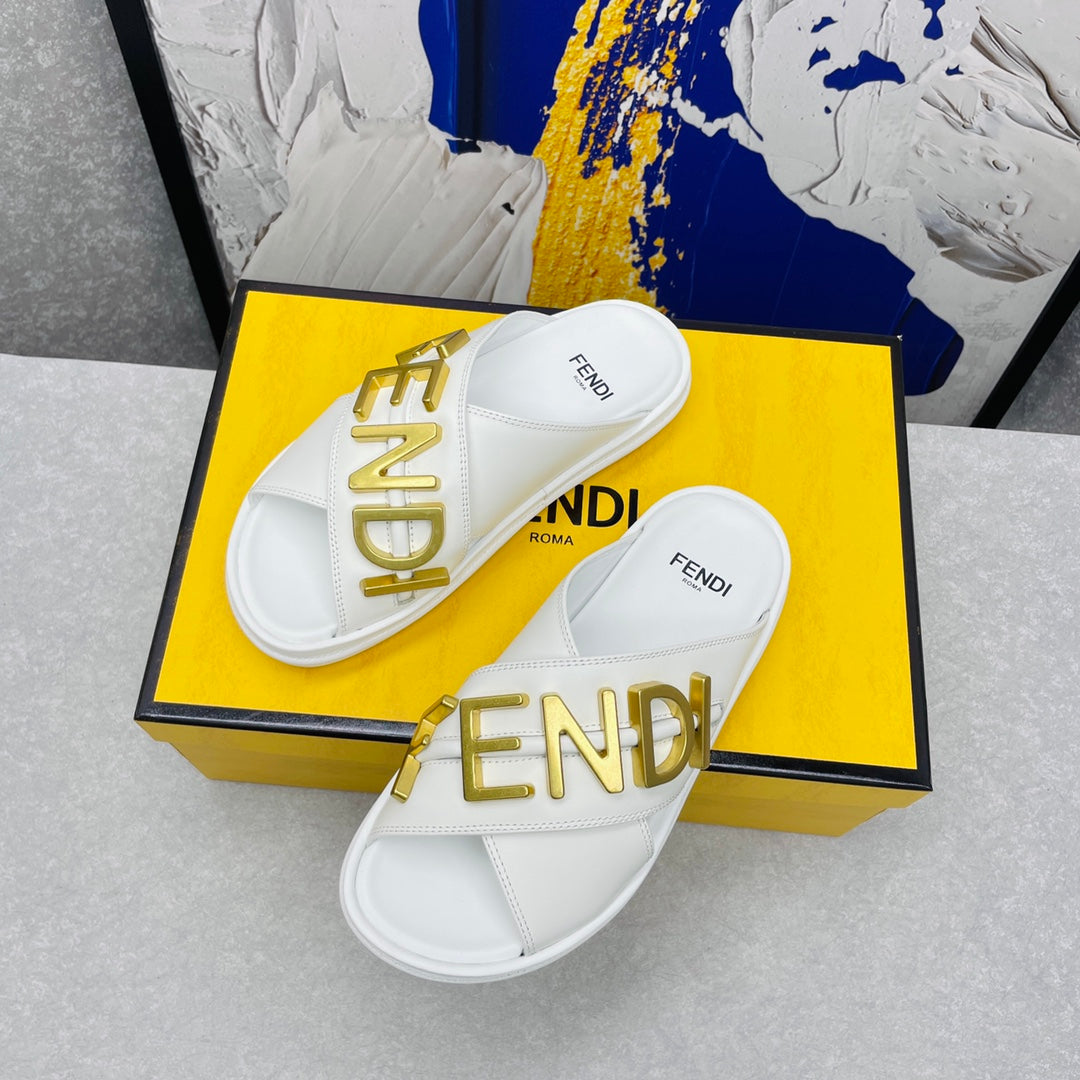 FENDI GRAPHY LOGO LETTERING SLIDES IN WHITE LAMBSKIN WITH GOLD HARDWARE