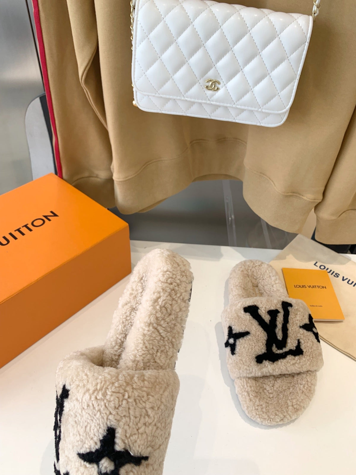 LV WOMEN'S PASEO FLAT SLIPPER IN TAN BROWN FLEECE WITH BLACK LOGO
