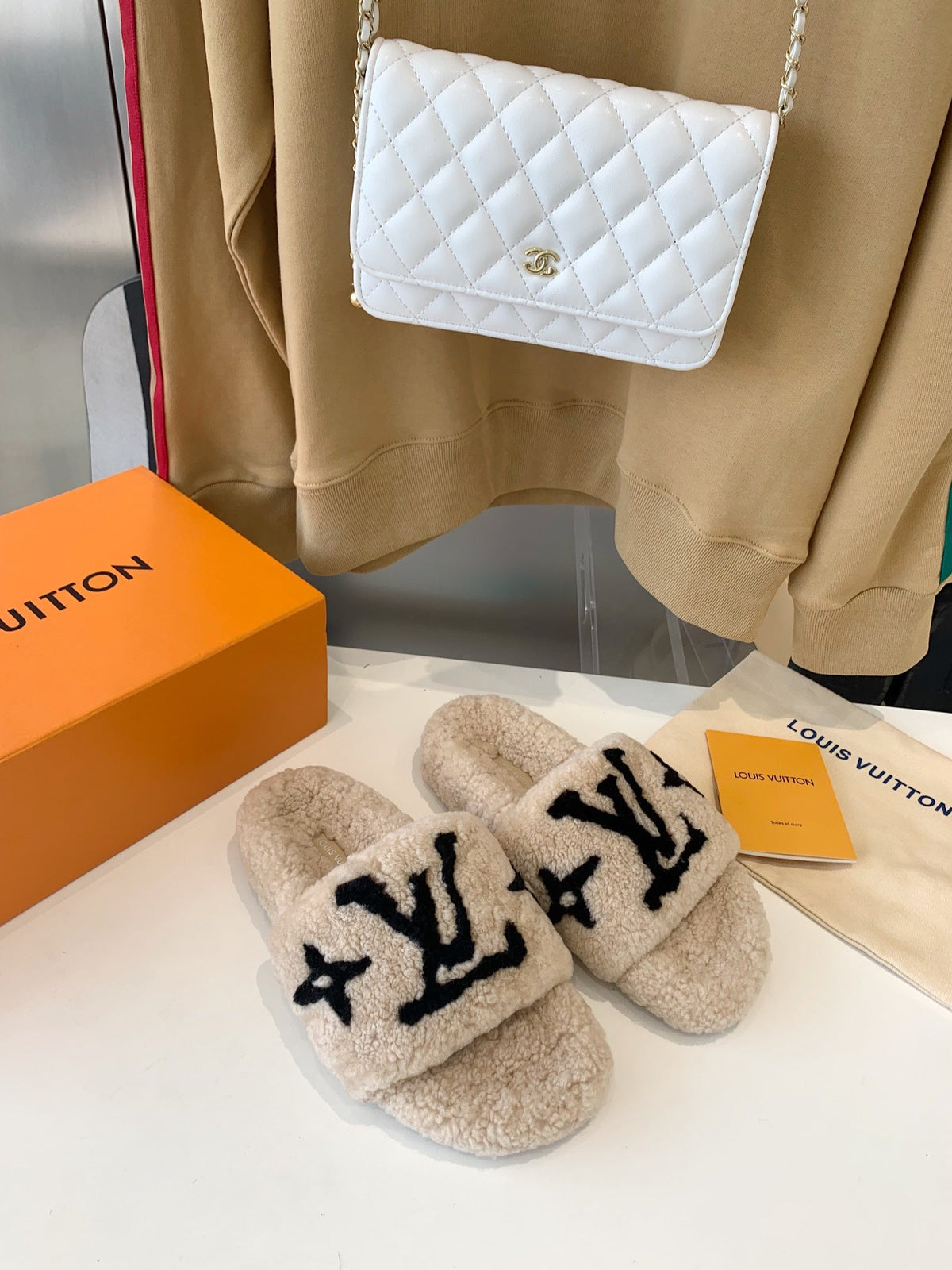LV WOMEN'S PASEO FLAT SLIPPER IN TAN BROWN FLEECE WITH BLACK LOGO