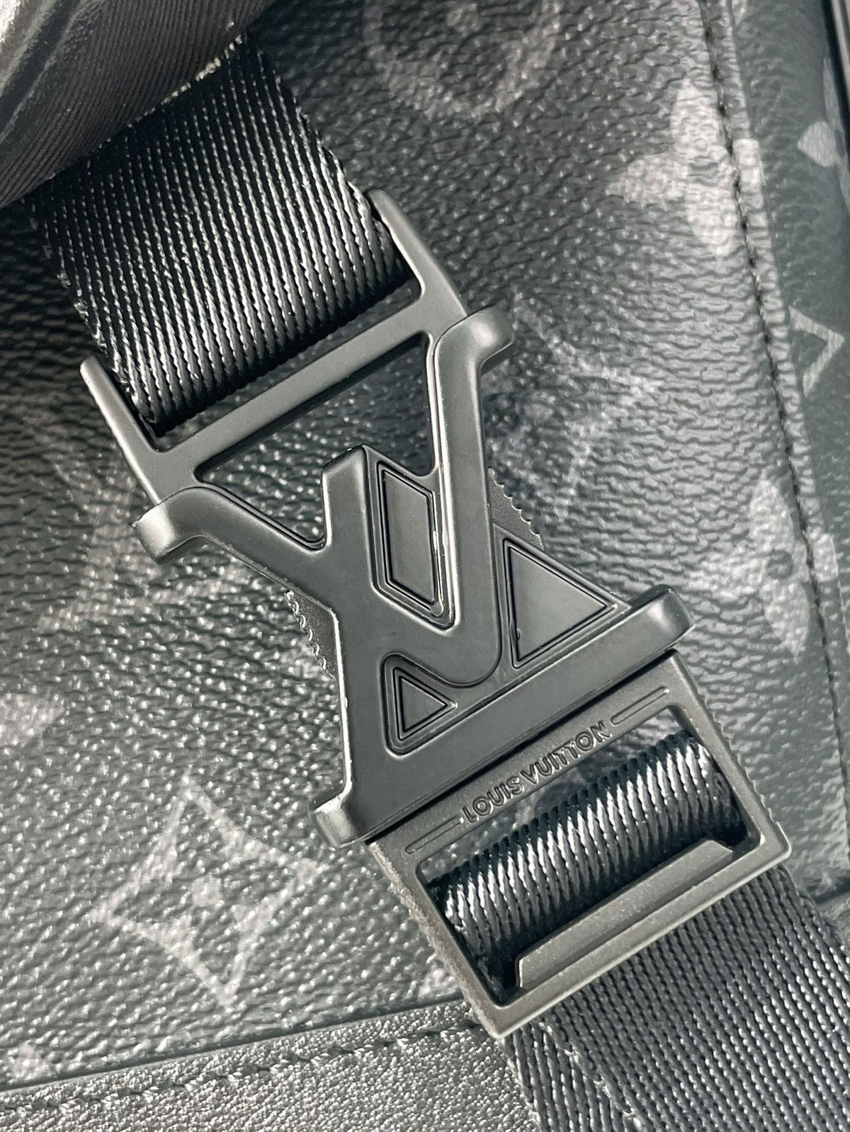 MESSENGER VOYAGER PM 33 IN GUN METAL MONOGRAM ECLIPSE CANVAS