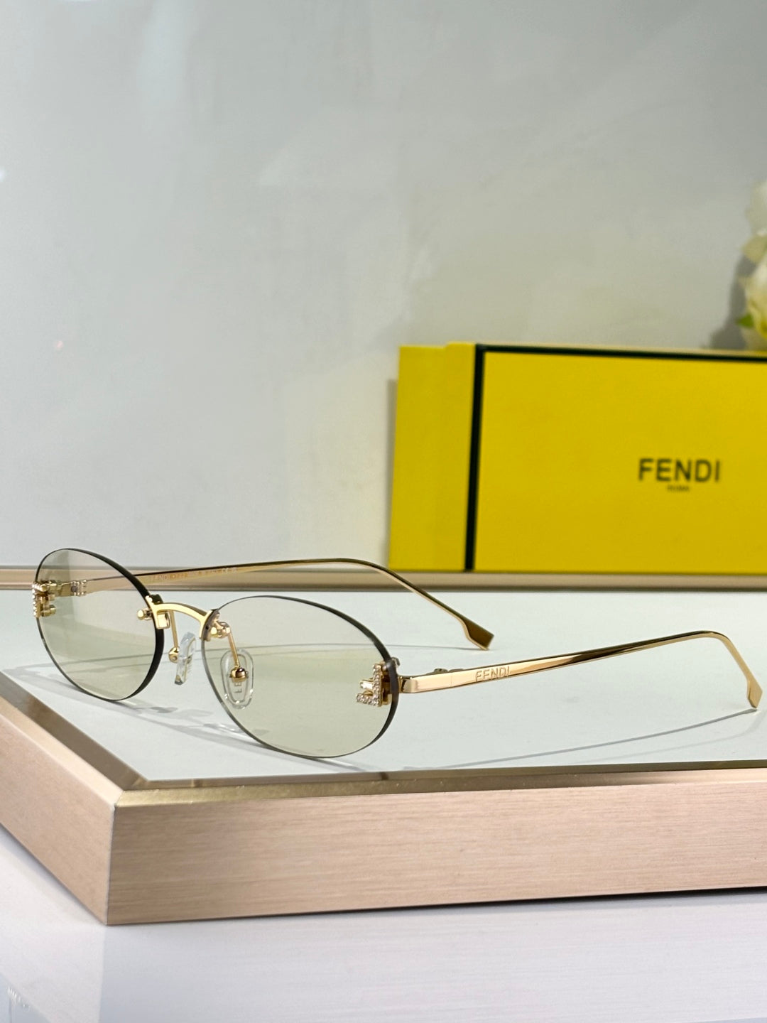 FIRST CRYSTAL RIMLESS OVAL FRAME SUNGLASSES FE4075US IN METAL