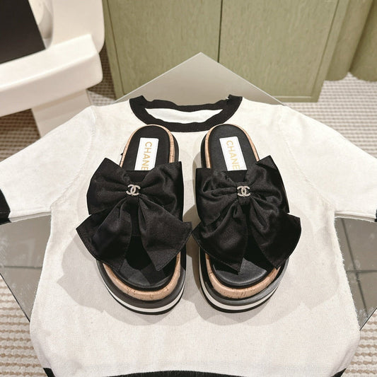 CC SLIPPERS WITH SILK BOW IN BLACK COWHIDE