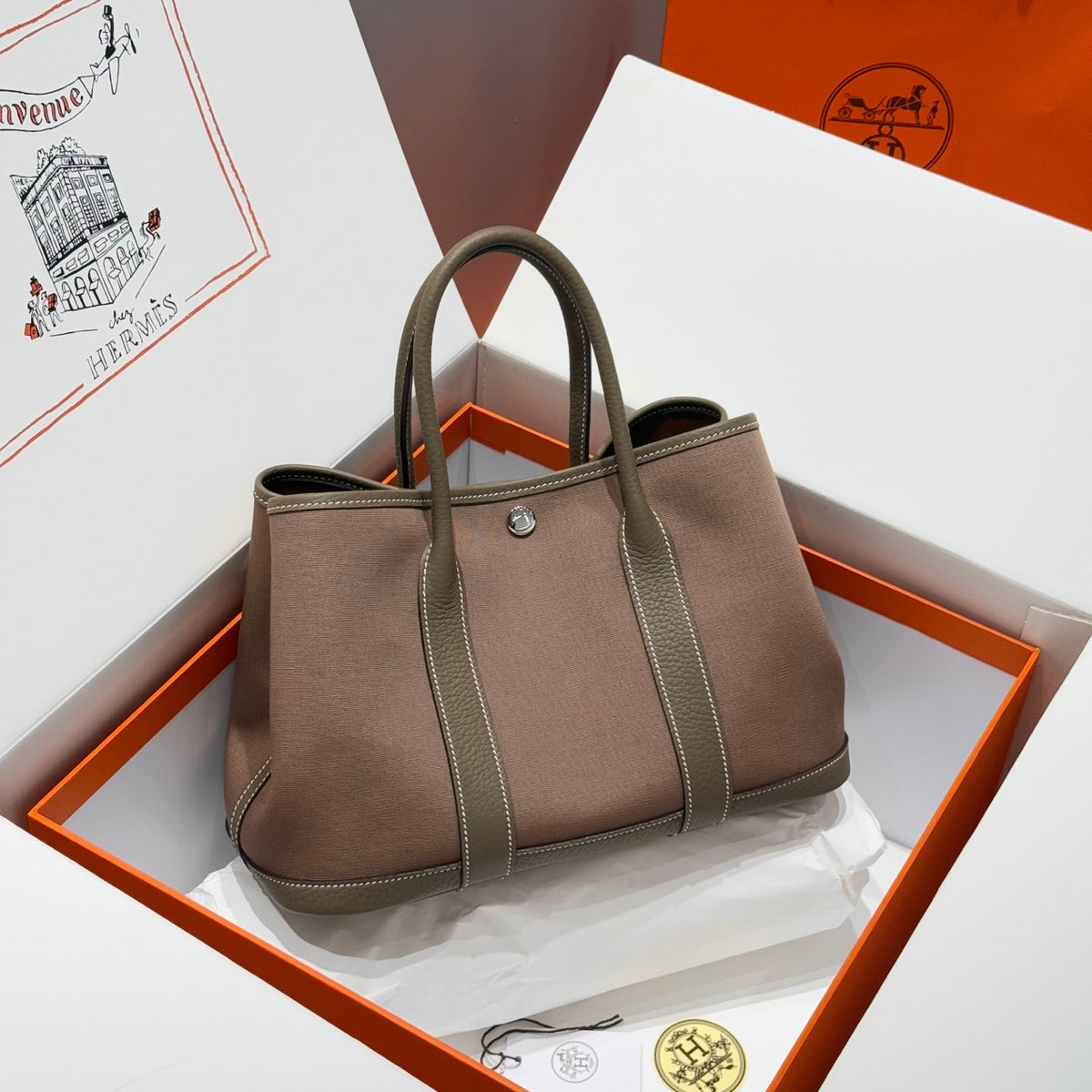 GARDEN PARTY 30CM IN BROWN TOILETS COTTON CANVAS AND TOGO ETOUPE CALFSKIN