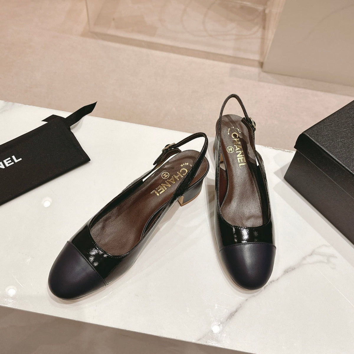 SLINGBACKS IN BLACK SHEEPSKIN