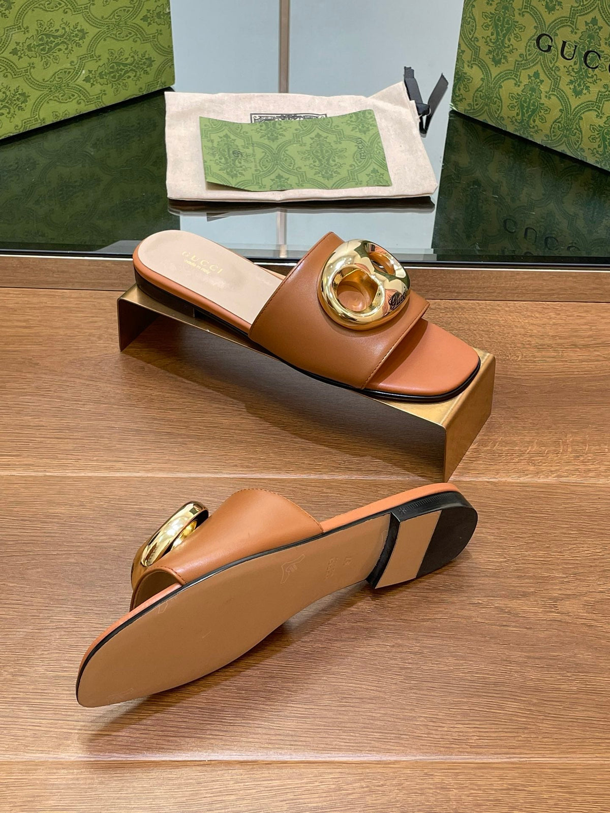 FLAT MULE IN BRONE BROWN CALFSKIN WITH GOLD HARDWARE