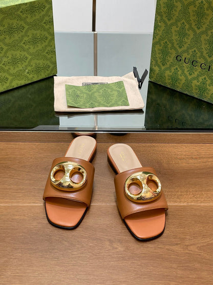 FLAT MULE IN BRONE BROWN CALFSKIN WITH GOLD HARDWARE