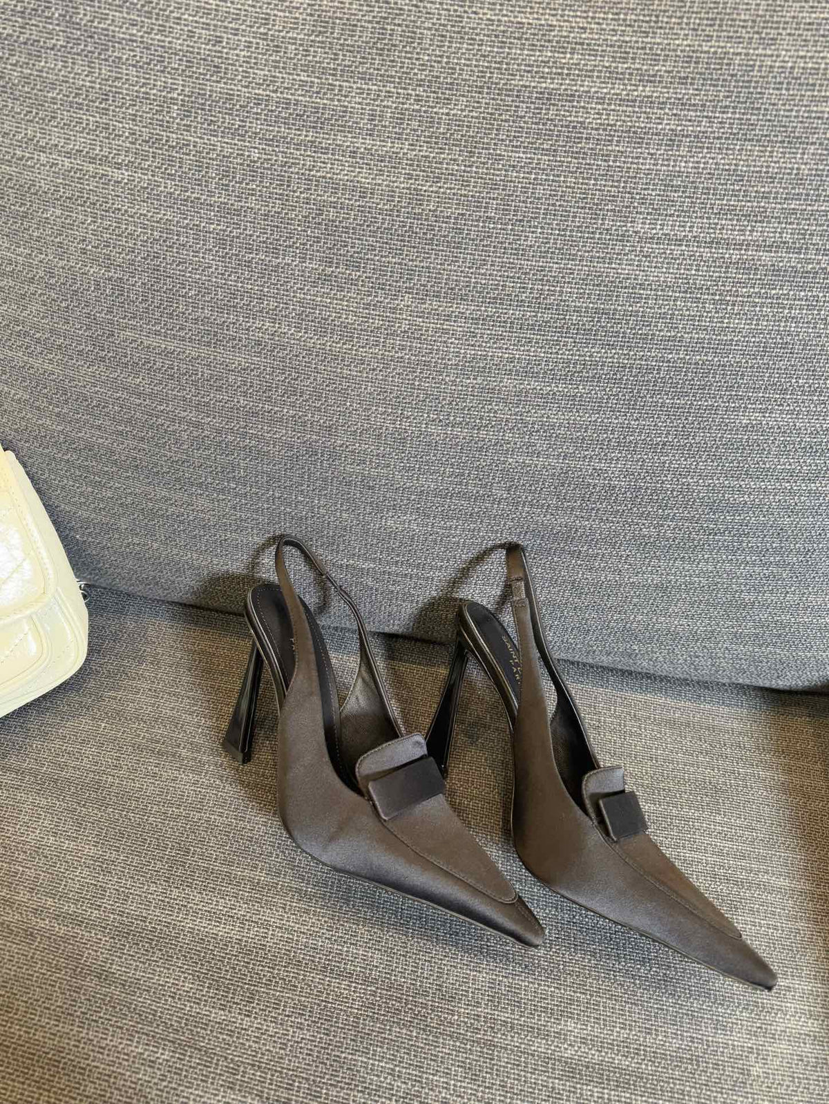 POINTED-TOE SLINGBACK PUMPS IN BLACK SILK