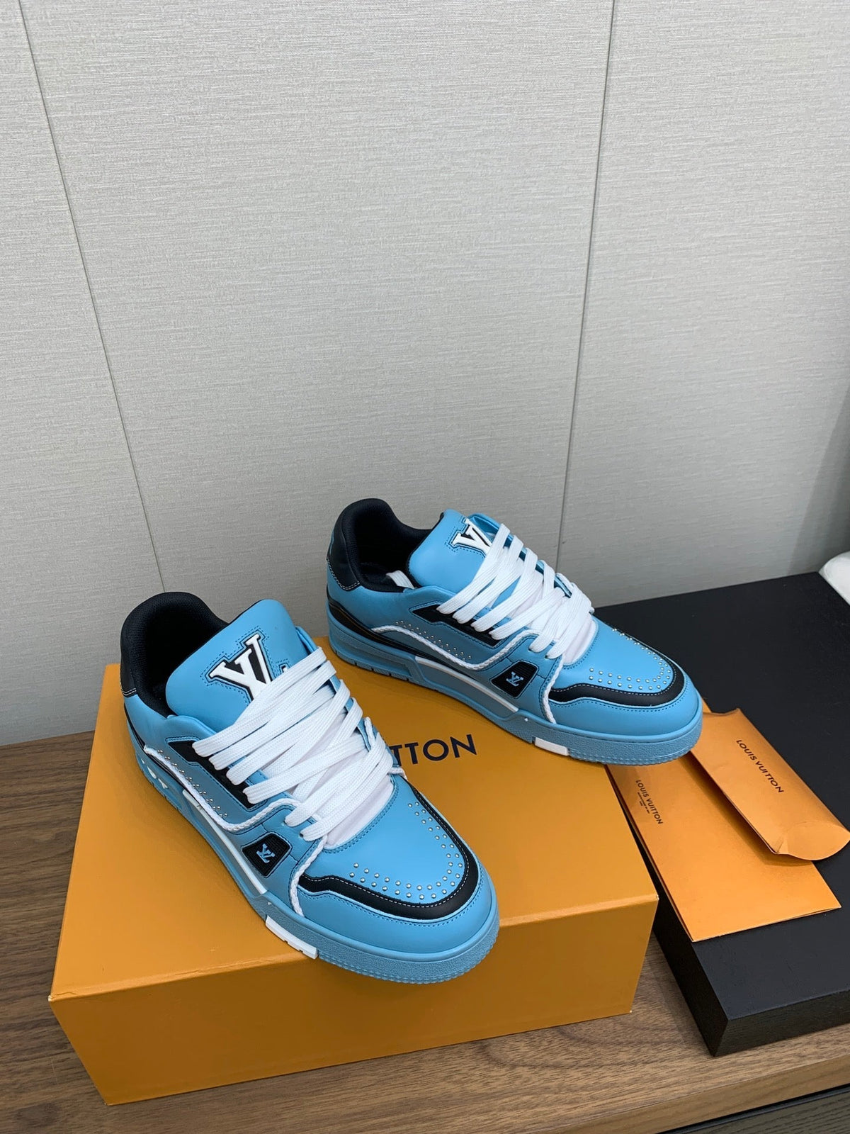 LV WOMEN'S TRAINER IN CERULEAN BLUE CALFSKIN