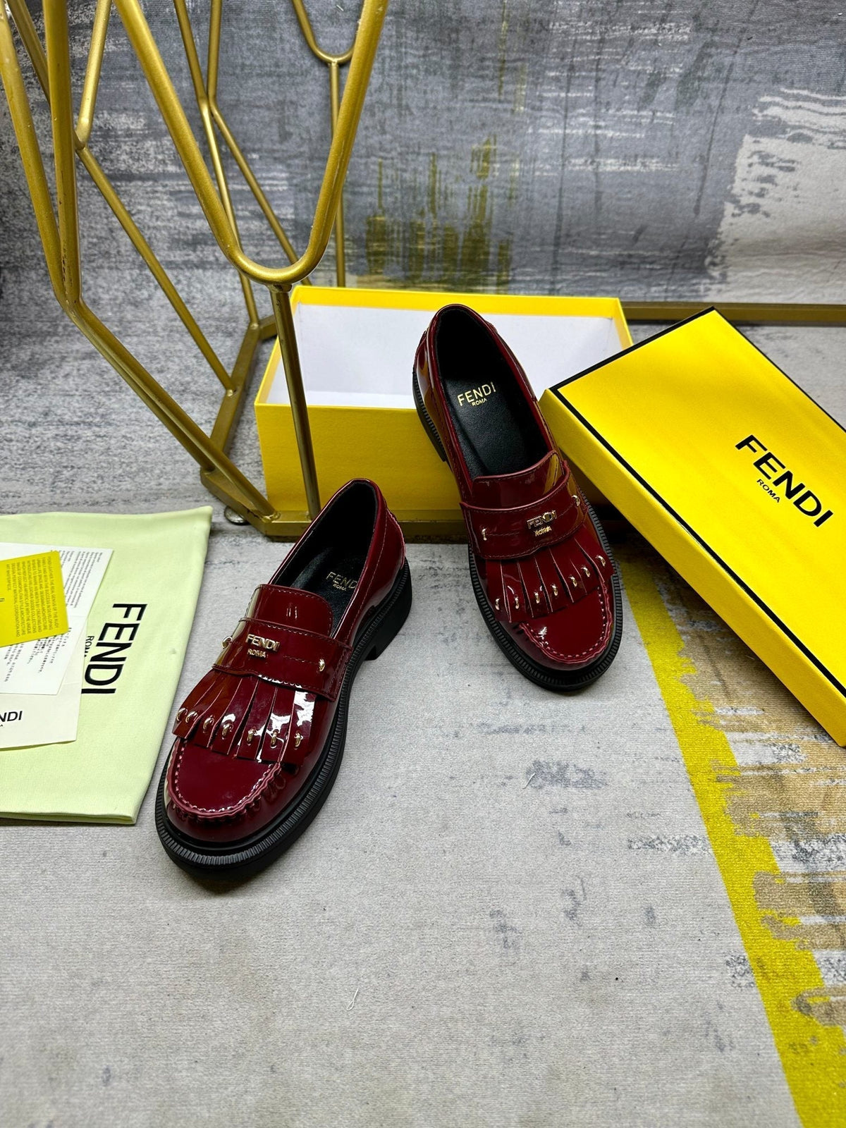 FENDI BAGUETTE LOAFERS IN MAROON RED CALFSKIN WITH GOLD HARDWARE