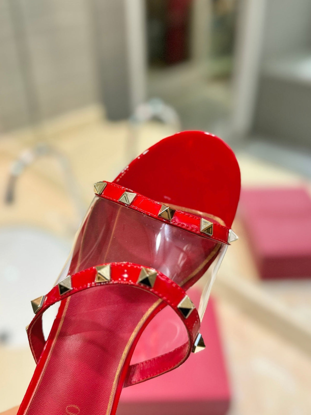 ROCKSTUD MULE SANDALS IN CHERRY RED CALFSKIN AND TRANSPARENT PVC FILM